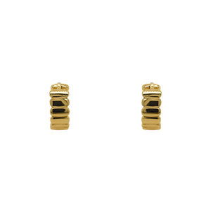
                  
                    Load image into Gallery viewer, Pair of hinged huggie earrings with a flat organic texture. 4.6mm wide and made of sterling silver with a 14kt yellow gold plating. Displayed forward facing on a white background.
                  
                