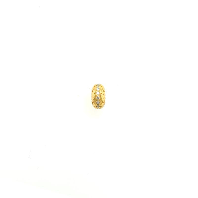 A front view of the larger textured spacer with diamonds along the middle. Shown on a white background.