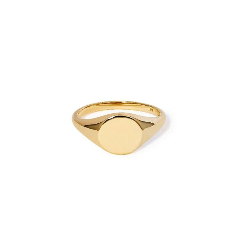 A front view of a medium yellow gold signet with a round face. Shown on a white background.