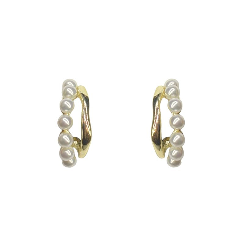 Organic gold vermeil hoops with a second hoop of pearls. Shown on a white background.