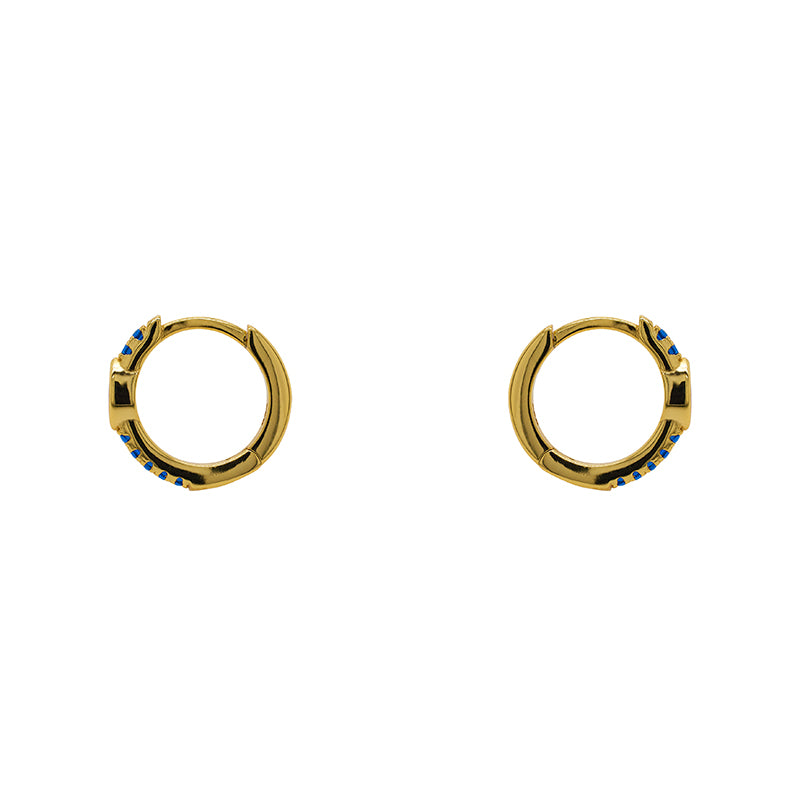 
                  
                    Load image into Gallery viewer, Huggie style earrings made of 14 kt yellow gold vermeil with round and marquise cut blue crystals. Displayed side facing on a white background.
                  
                