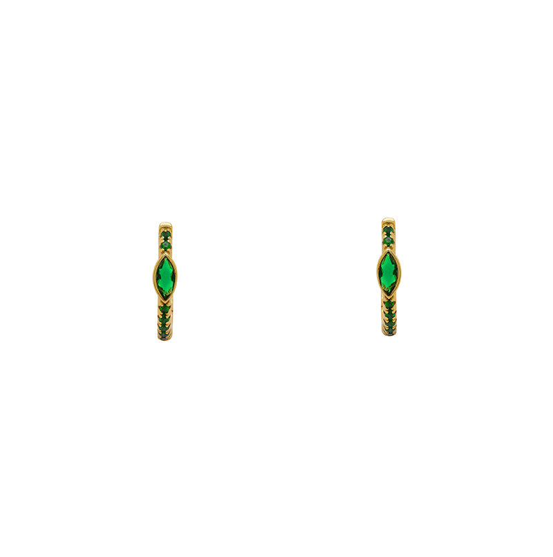Huggie style earrings made of 14 kt yellow gold vermeil with round and marquise cut green crystals. Displayed forward facing on a white background.