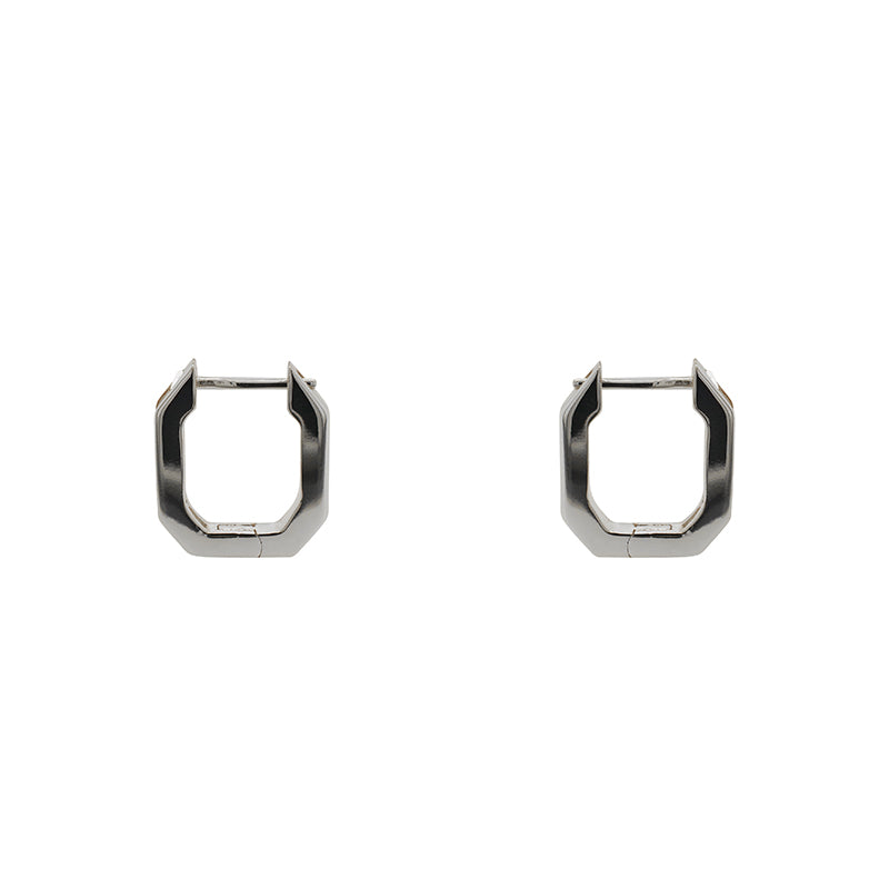 
                  
                    Load image into Gallery viewer, Geometric shaped hoop earrings made of 925 sterling silver hoops have tiny baguette crystals set on one side. Displayed side facing and on a white background.
                  
                