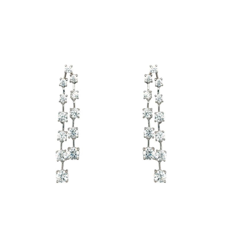 A pair of sterling silver and prong set round crystal earrings with two drops. Shown on a white background.