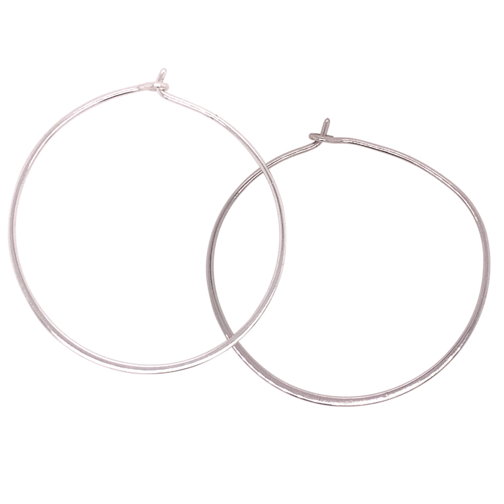 
                  
                    Load image into Gallery viewer, Modern, thin hoop earrings measuring at 37 mm. Made of 925 sterling silver with 14kt yellow gold vermeil. Displayed side facing on a white background.
                  
                