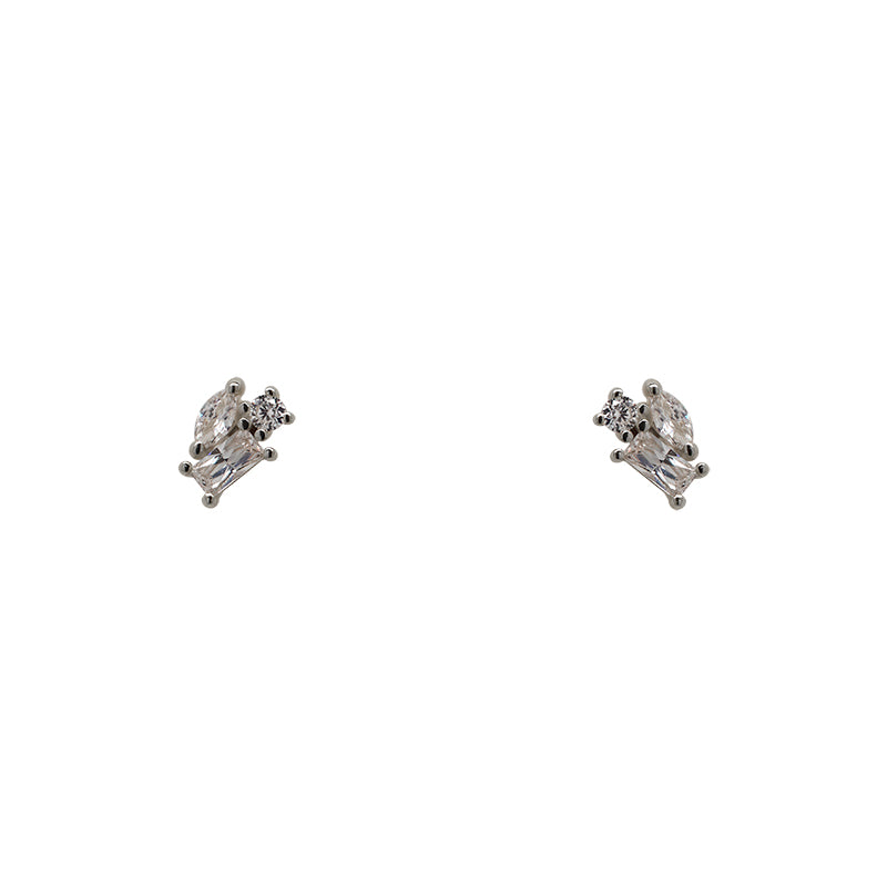 A pair of 925 sterling silver cluster studs each containing one marquise, one round and one baguette crystal on a white background.