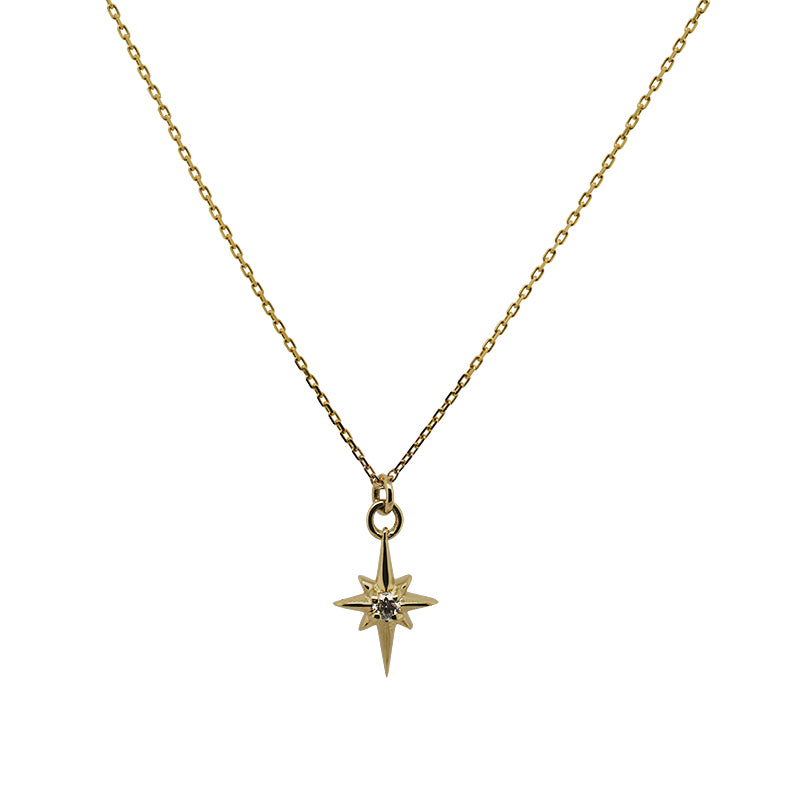 
                  
                    Load image into Gallery viewer, Petite size north star charm necklace with a tiny diamond in the center made of solid 14 kt yellow gold.
                  
                