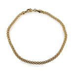 Overview of a gold filled petite link style anklet on a white background.