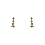 A pair of north south set double crystal studs with an additional stud dangling from the bottom, and made of 14 kt yellow gold vermeil.
