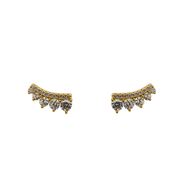 A pair of 14 kt yellow gold vermeil earrings with a soft curve of white pavé set crystals get a bold trimming of 5 graduated white crystals.