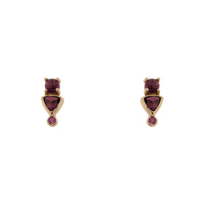 
                  
                    Load image into Gallery viewer, Front view of rhodolite garnet stud earrings with round, cabochon, and trillion cut stones set in 14 kt yellow gold settings. Displayed on a white background.
                  
                