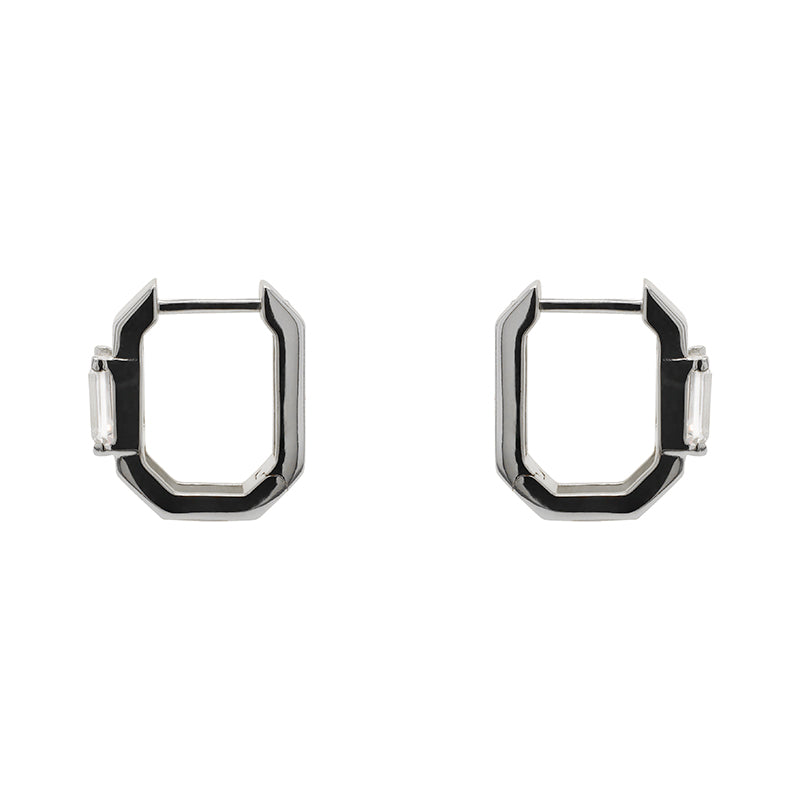 A pair of geometric shaped hoop earrings each having one baguette cut crystal and made of 925 sterling silver.