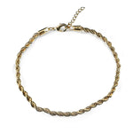 Overview of a gold filled rope link style anklet on a white background.