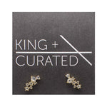 Pair of earrings with 7 round crystals in varied sizes clustered in a row. Made of sterling silver with 14k yellow gold plating.