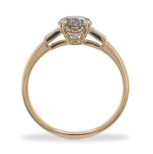
                  
                    Load image into Gallery viewer, Side view of a round cut salt and pepper diamond ring flanked by 2 baguette cut diamonds, and cast in 14 kt yellow gold.
                  
                