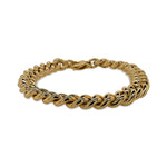 Front view of a large curb link style bracelet made of 14 kt yellow gold.