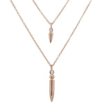 Front view of one small diamond spike necklace and one large diamond spike necklace cast in 14 kt rose gold.
