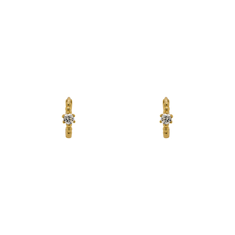 
                  
                    Load image into Gallery viewer, A pair of huggie style earrings each with a dot pattern and 2.5 mm crystal and made of 14 kt yellow gold vermeil. Displayed forward facing on a white background.
                  
                