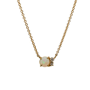 
                  
                    Load image into Gallery viewer, A Cabochon opal cluster necklace with two round cut diamonds cast in 14 kt yellow gold.
                  
                