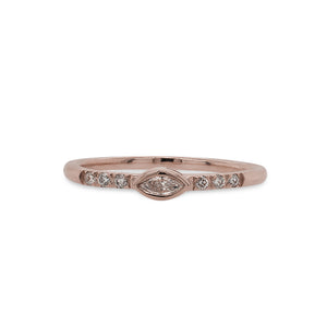 
                  
                    Load image into Gallery viewer, Front view of a 14 kt rose gold ring with an east west, bezel set marquise diamond in the center and 3 smaller, round diamonds on either side.
                  
                