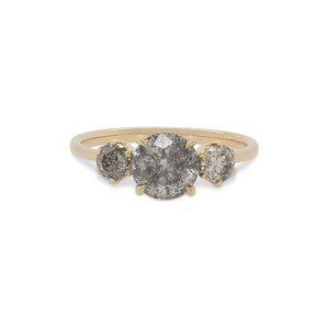 
                  
                    Load image into Gallery viewer, Front view of a salt and pepper diamond ring with one large, round center stone between 2 smaller round stones cast in 14 kt yellow gold by King + Curated.
                  
                
