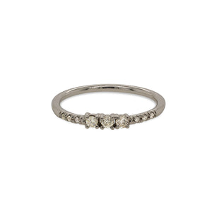 
                  
                    Load image into Gallery viewer, Front view of a diamond ring with 3 center round cut diamonds flanked by 6 round cut pavé set diamonds cast in 14 kt white gold.
                  
                