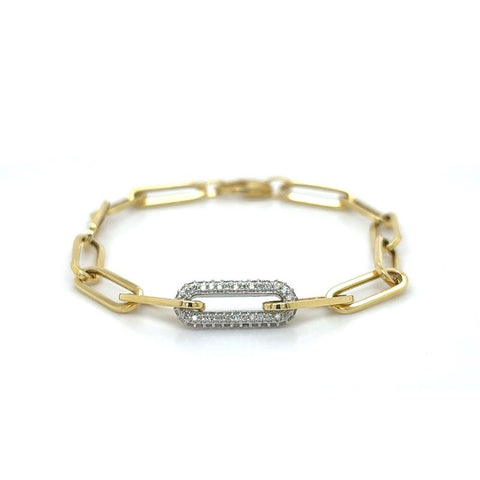 A yellow gold paperclip bracelet with the center link in white gold encased in white diamonds.