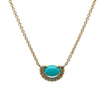Front view of a 14 kt yellow gold pendant necklace with a center, cabochon cut turquoise surrounded by over 0.25 tcw of diamonds.