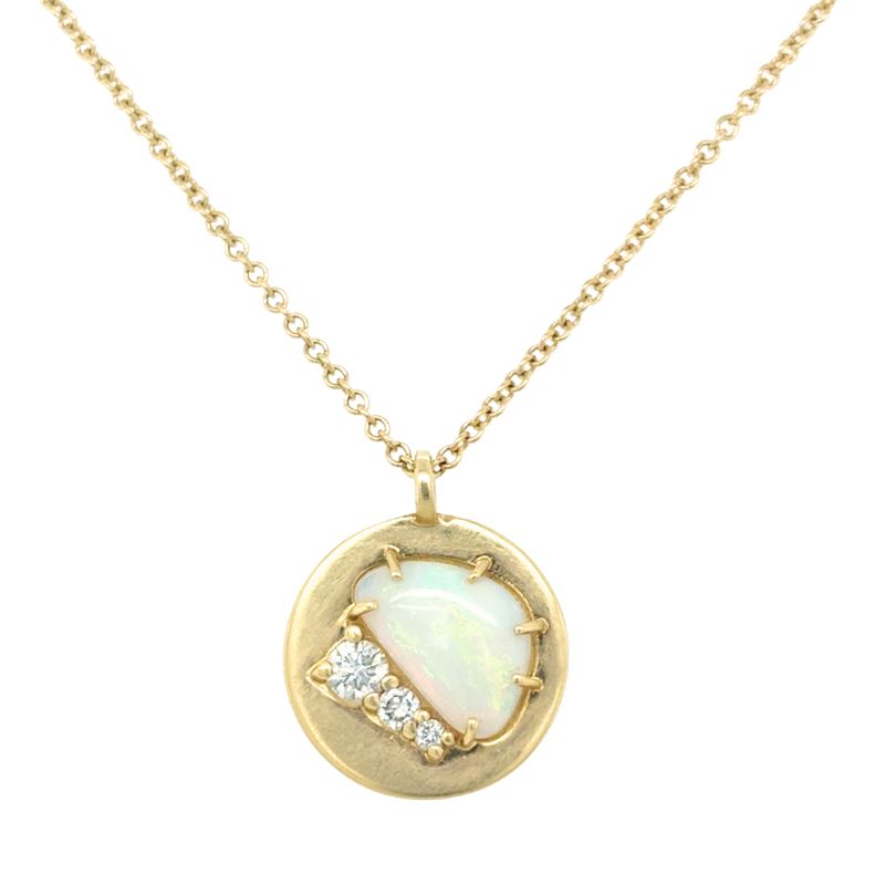 A front view of a yellow gold pendant with an opal and three round diamonds shown on a white background.