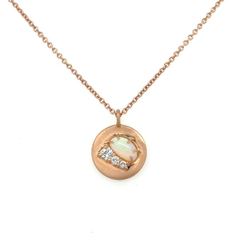A front view of a rose gold pendant with an opal and three round diamonds shown on a white background.
