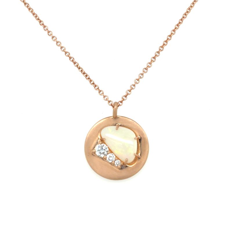 A front view of a rose gold pendant with an opal and three round diamonds shown on a white background.
