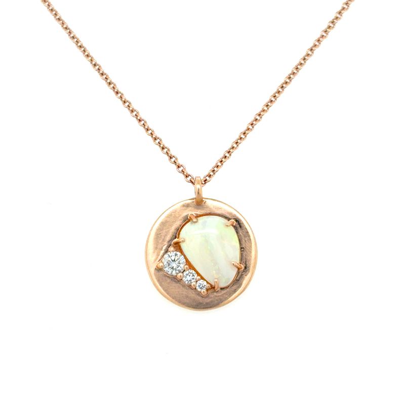 A front view of a rose gold pendant with an opal and three round diamonds shown on a white background.