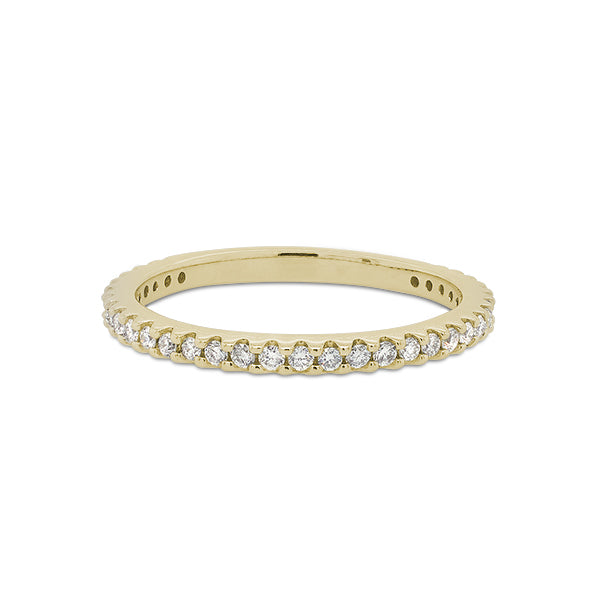 Front view of a 3/4 diamond eternity band set with round cut diamonds in a 14 kt yellow gold setting.