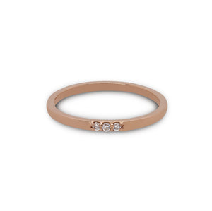 
                  
                    Load image into Gallery viewer, Front view of 3 diamond stacking band cast in 14 kt rose gold.
                  
                