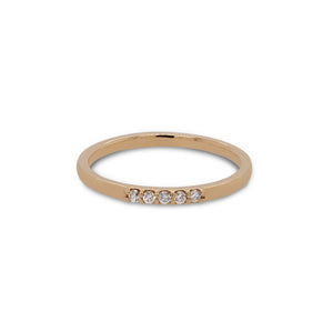 
                  
                    Load image into Gallery viewer, Front view of 5 diamond stacking band cast in 14 kt yellow gold.
                  
                