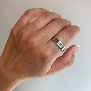 
                  
                    Load image into Gallery viewer, Front view on left index finger of 5mm squared edge band with 2 darkened lines in 14kt white gold.  Edit alt text
                  
                