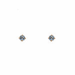 Front view of 3.3 mm round cut, aquamarine studs set in 4 prong 14 kt yellow gold settings.