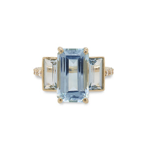 
                  
                    Load image into Gallery viewer, Front view of a triple stone, light blue aquamarine ring with emerald and baguette cuts and round diamonds going half way around the shank and cast in 14 kt yellow gold.
                  
                