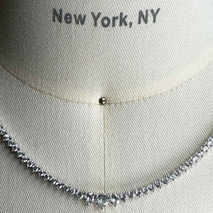 
                  
                    Load image into Gallery viewer, Close up of a graduated crystal necklace with a sterling silver setting on a body form for scale.
                  
                