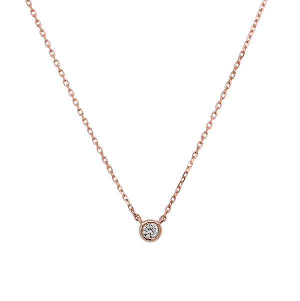 
                  
                    Load image into Gallery viewer, Front view of a bezel set diamond solitaire pendant necklace cast in 14 kt rose gold.
                  
                