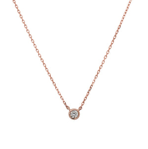 
                  
                    Load image into Gallery viewer, Front view of a bezel set diamond solitaire pendant necklace cast in 14 kt rose gold.
                  
                