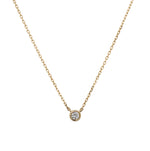 Front view of a bezel set diamond solitaire pendant necklace cast in 14 kt yellow gold.