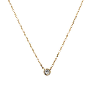 
                  
                    Load image into Gallery viewer, Front view of a bezel set diamond solitaire pendant necklace cast in 14 kt yellow gold.
                  
                