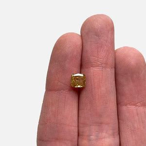 
                  
                    Load image into Gallery viewer, View of 0.85ct cushion cut yellow diamond on ladies hand for scale.
                  
                
