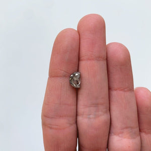 
                  
                    Load image into Gallery viewer, View of 1.20 ct salt and pepper half moon cut diamond on ladies hand for scale.
                  
                