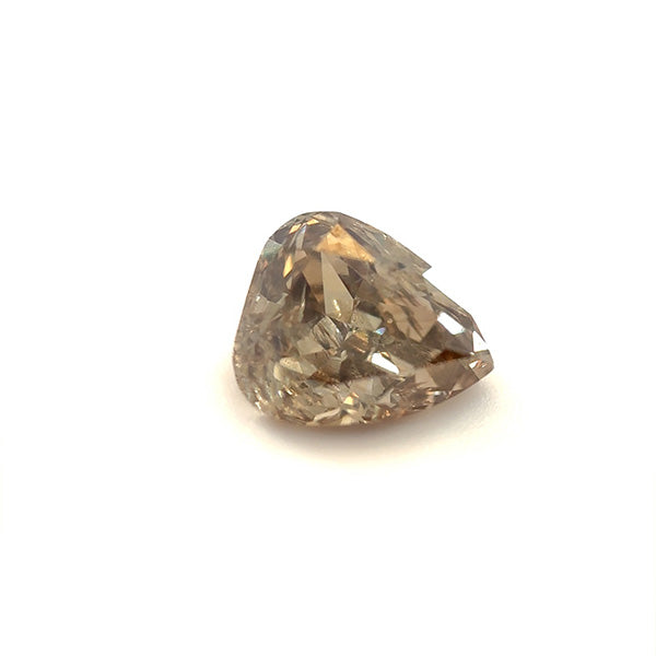 
                  
                    Load image into Gallery viewer, Front view of a 1.06 ct light brown pear diamond on a white background.
                  
                