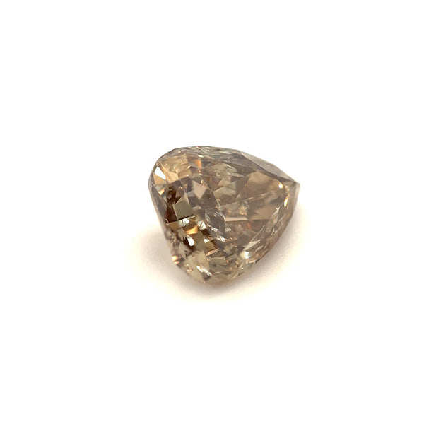 
                  
                    Load image into Gallery viewer, 3/4 view of a 1.06 ct light brown pear diamond on a white background.
                  
                