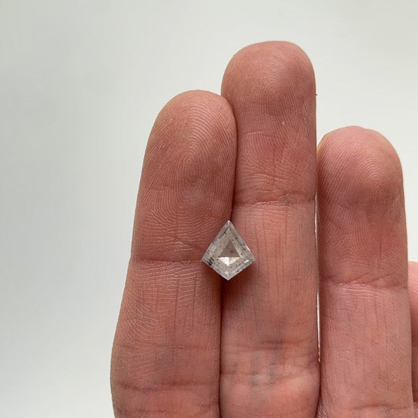 Front view of a 1.64 ct. salt and pepper kite cut diamond on ladies hand for scale.