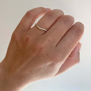 
                  
                    Load image into Gallery viewer, Front view on ladies left ring finger of a shadow band with 27 one and a half mm round diamonds set in 14 kt Yellow gold.
                  
                