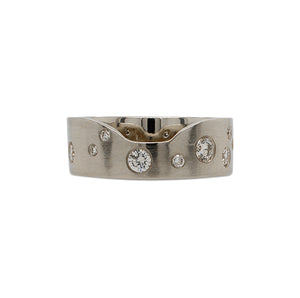 
                  
                    Load image into Gallery viewer, Front view of a notched out cigar band scattered with approx 0.62 ct of burnish set round cut diamonds cast in 14 kt white gold.
                  
                